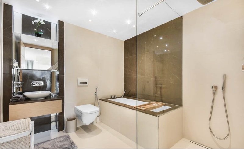 Bathroom with bath and shower