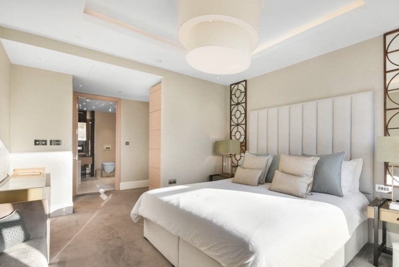Principal bedroom with upholstered headboard