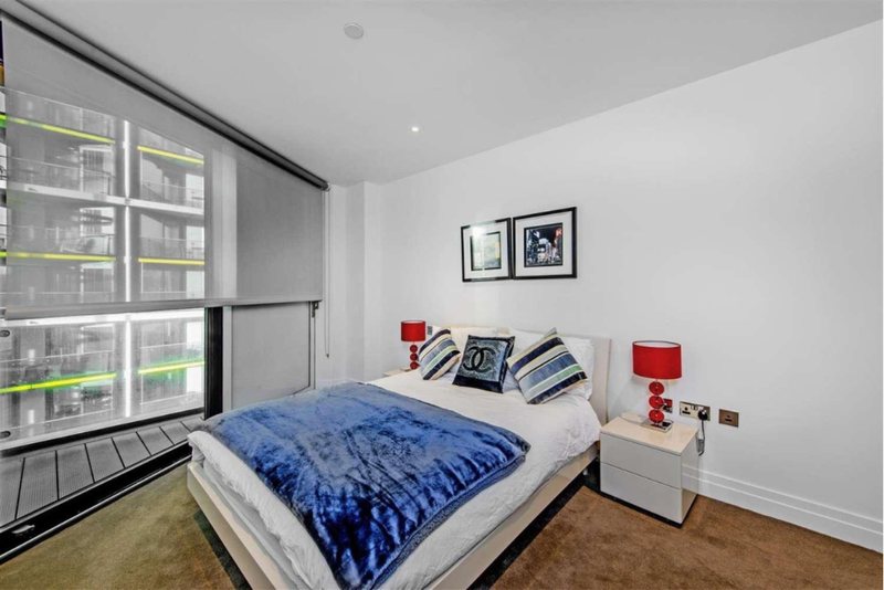 Bedroom with floor-to-ceiling window
