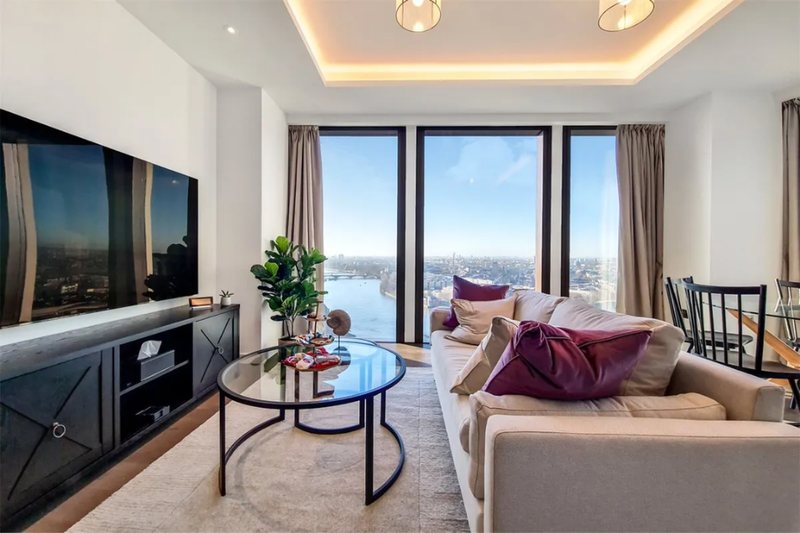 Living room with media unit and river views