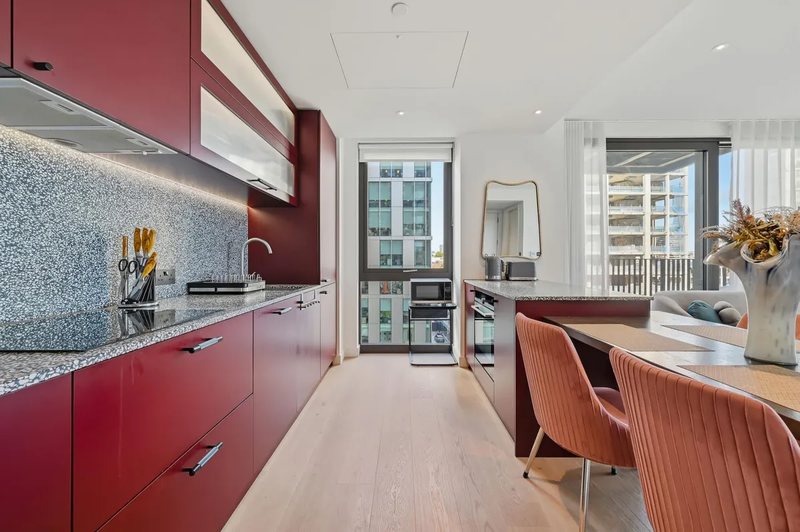 Kitchen with red cabinetry
