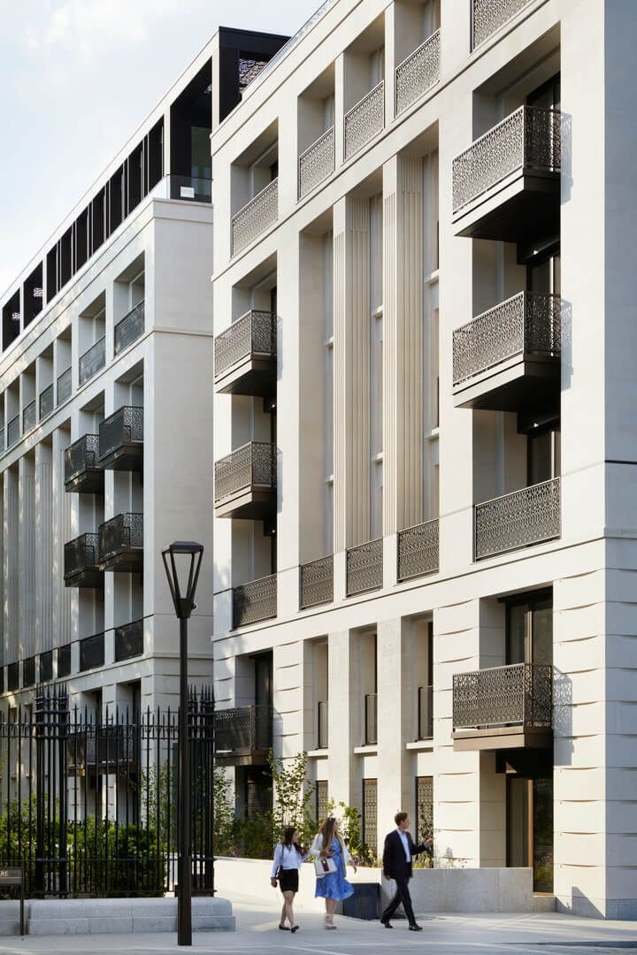 Street of pale-stone London apartment buildings with balconies